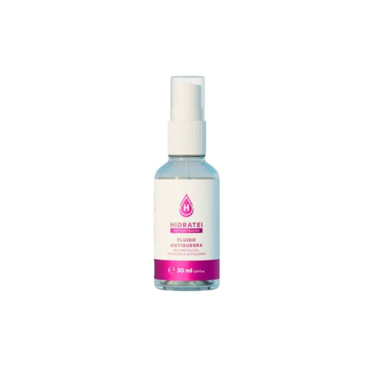 Frasco-transparente-com-tampa-branca-contendo-Fluido-Antiquebra.-Rotulo-branco-e-rosa-com-informacoes-sobre-nutricao-e-fortalecimento-capilar.