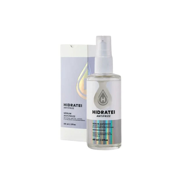 Frasco-transparente-com-tampa-spray-e-rotulo-minimalista-ao-lado-de-uma-caixa-branca-refletiva.-Embalagem-destaca-o-Serum-Vegano-antifrizz.
