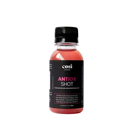 Frasco-preto-com-tampa-preta-contendo-Shot-Antioxidante-liquido-avermelhado-rotulo-com-detalhes-rosa-e-descricao-dos-ingredientes-naturais.